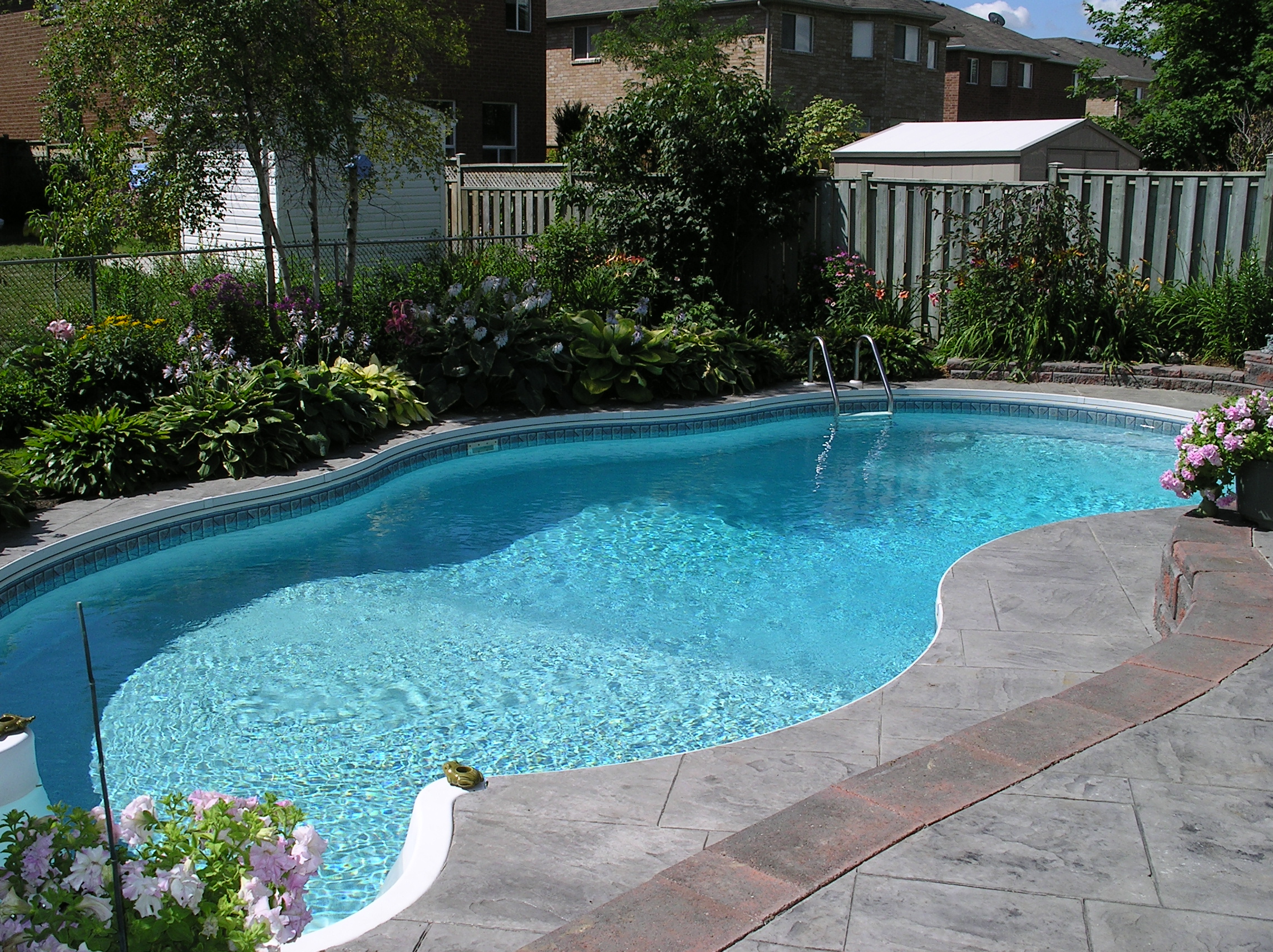 Backyard swimming pool in need of pool pump repair service in Winnipeg